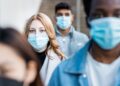 A group of people wearing masks Description automatically generated with medium confidence